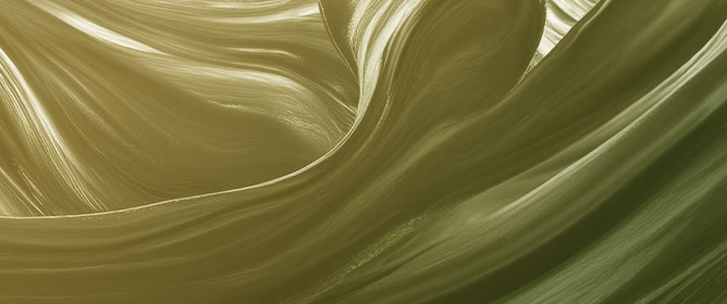 Trapped Modes Along Periodic Structures Submerged in a Two-Layer Fluid with Free Surface and a Background Steady Flow